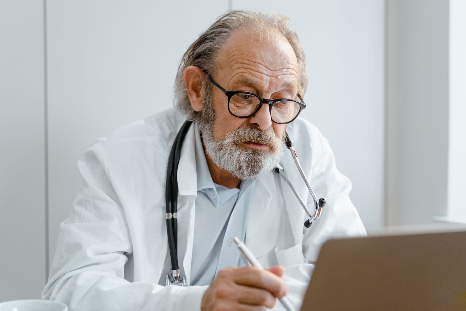 A senior man talking with his doctor