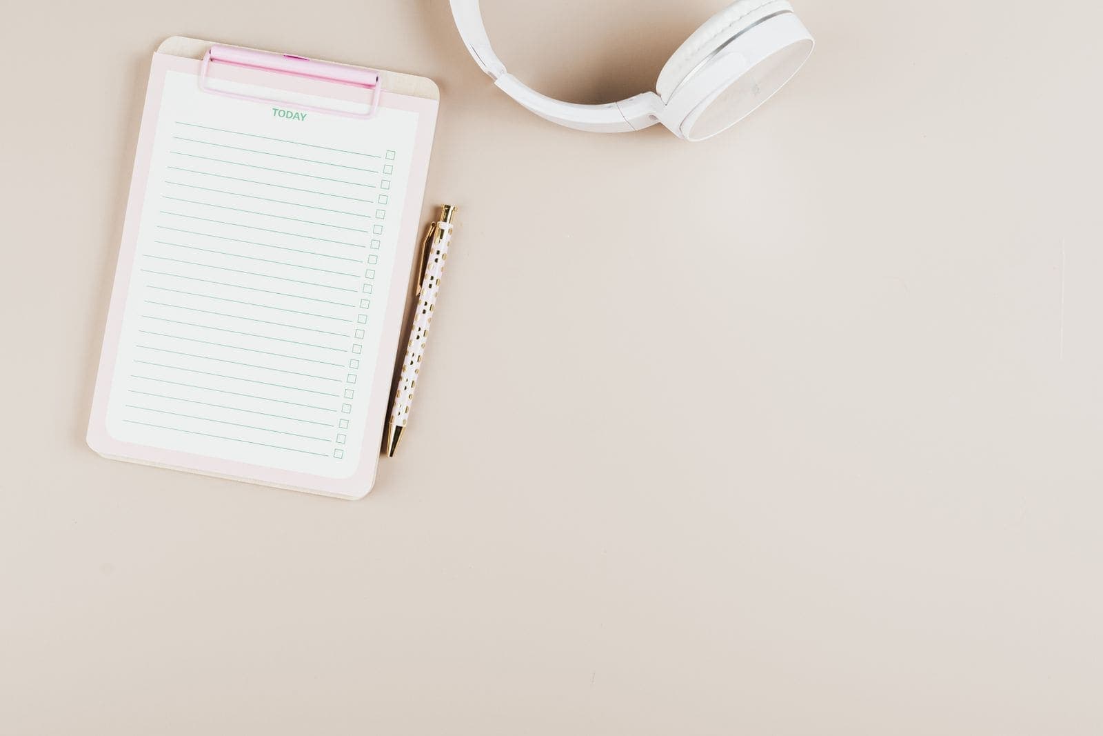 A checklist and notepad on a desk