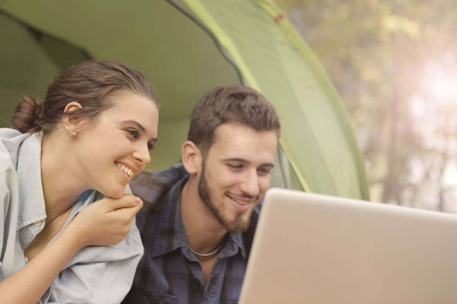 A couple looking over options on a laptop