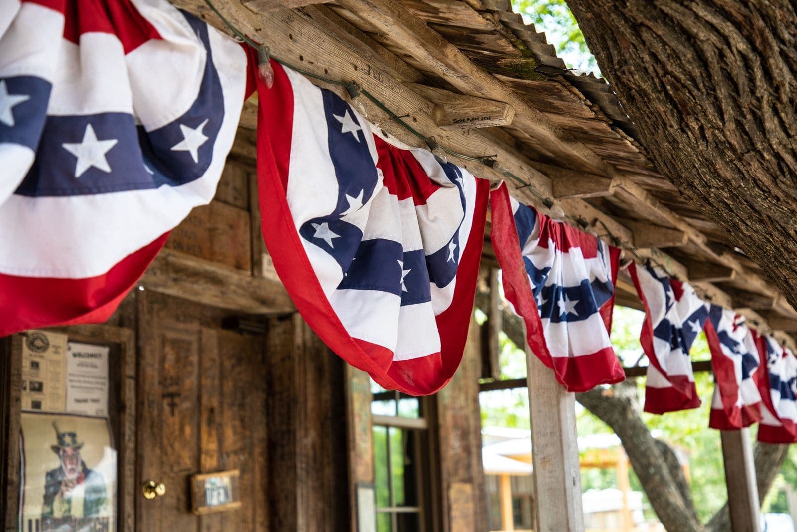 An American flag on a front porch