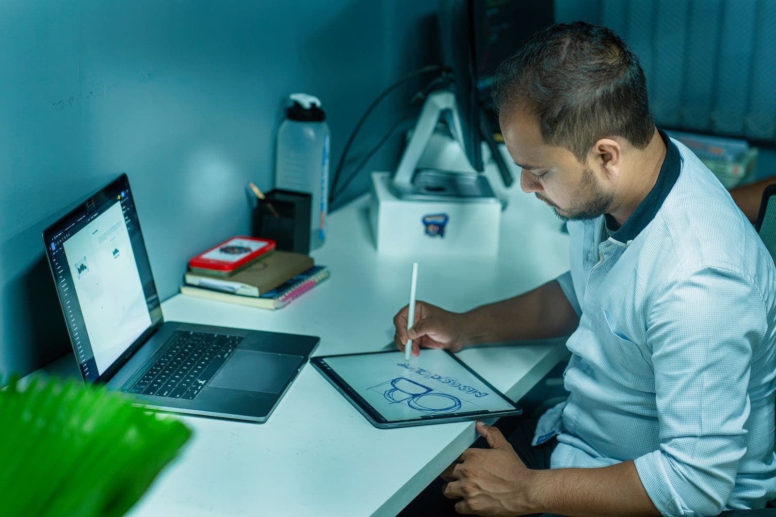A graphic designer working in a home studio